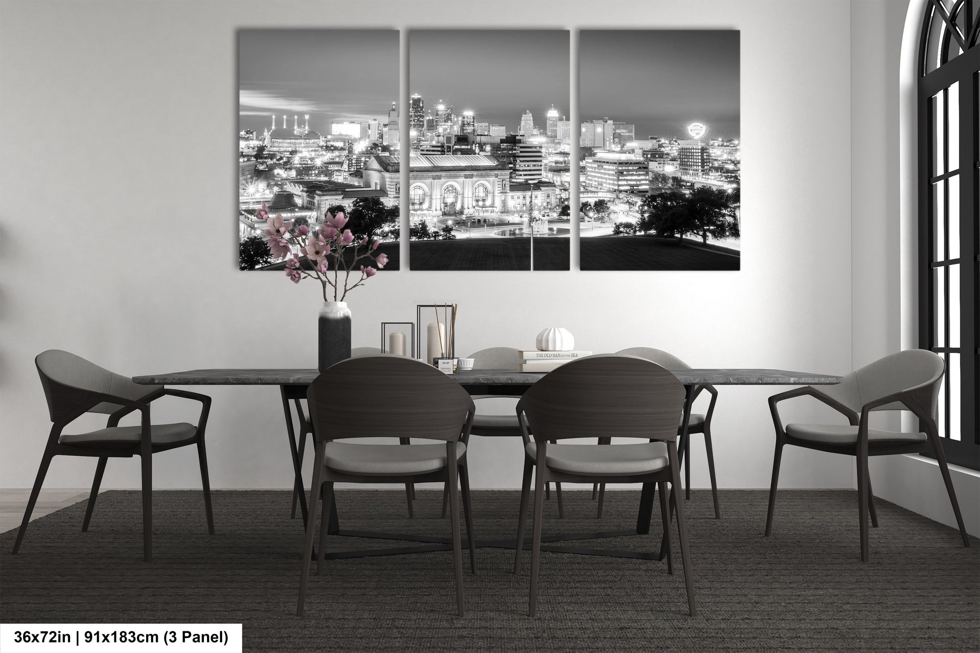 a black and white photo of a dining room