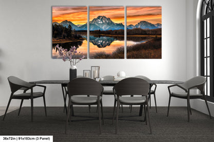 a dining room table with chairs and a painting on the wall