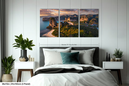 a bedroom with a bed and two paintings on the wall