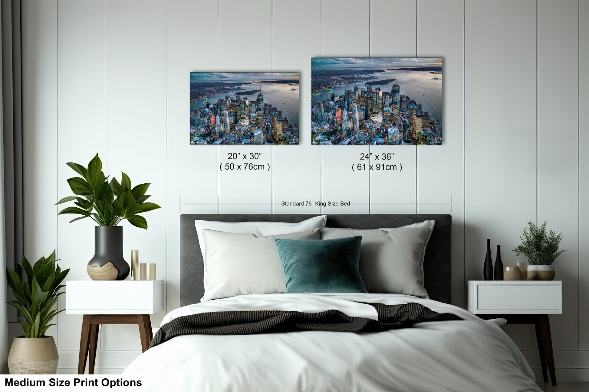 a bed with two pictures on the wall above it