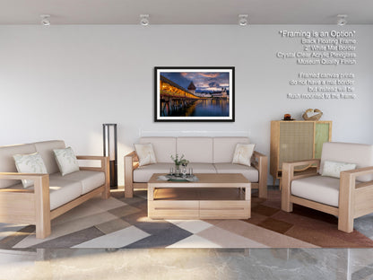 a living room filled with furniture and a painting on the wall