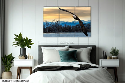 a large bird flying over a bed in a bedroom