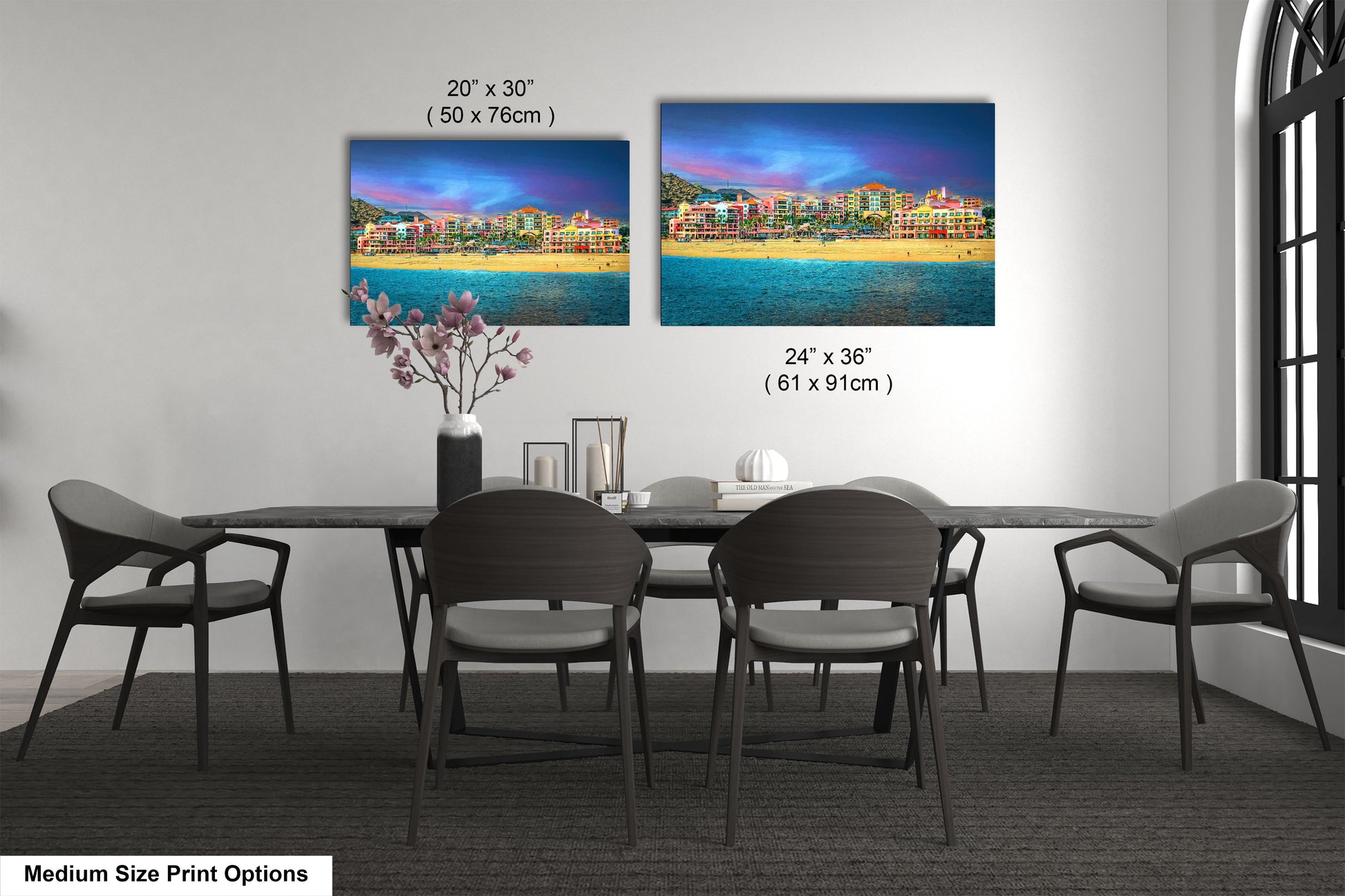 a dining room table with four chairs and a vase of flowers