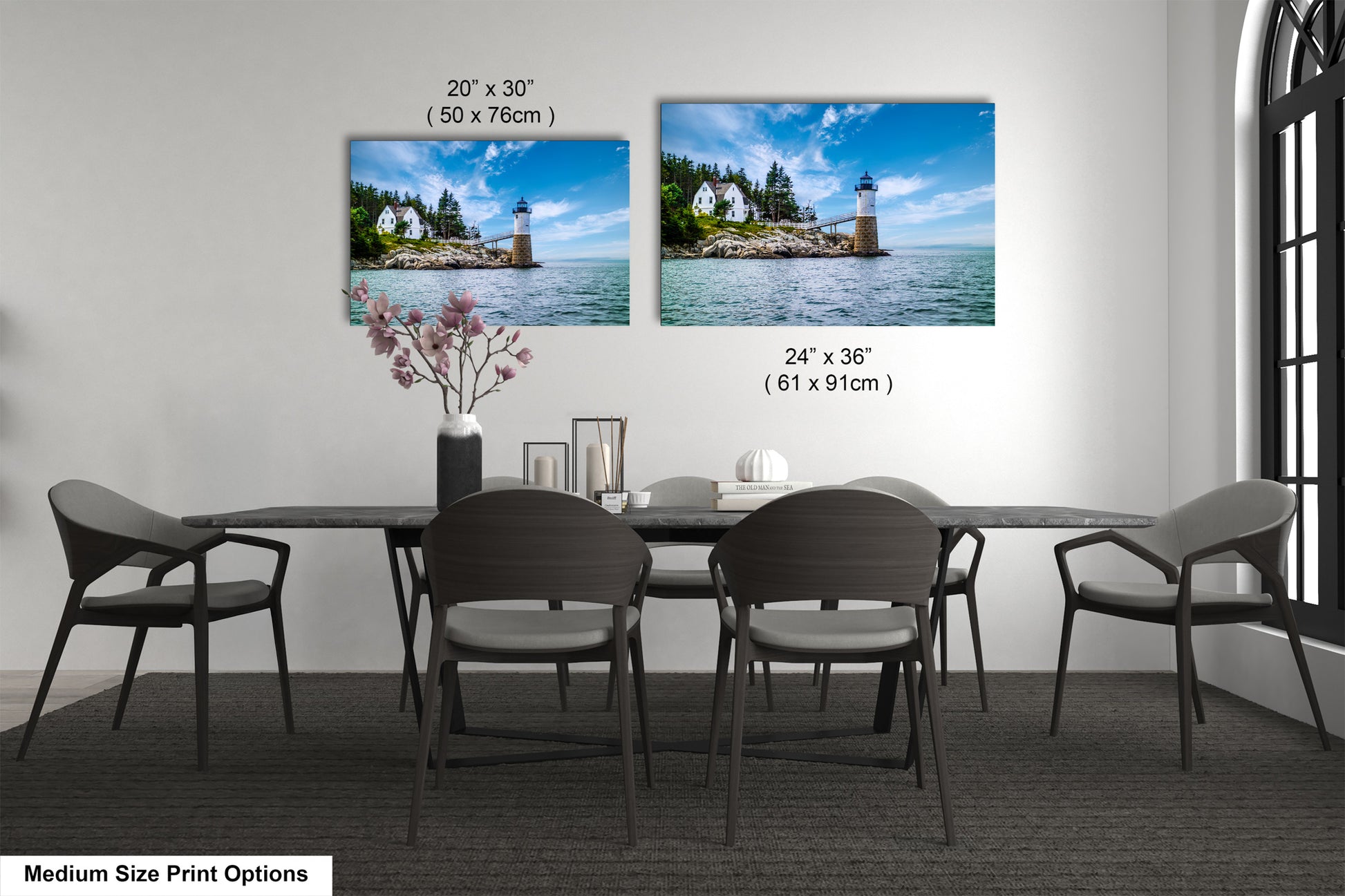 a dining room table with four chairs and a picture of a lighthouse