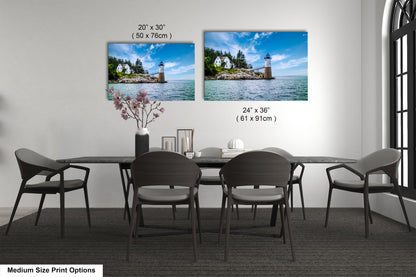 a dining room table with four chairs and a picture of a lighthouse