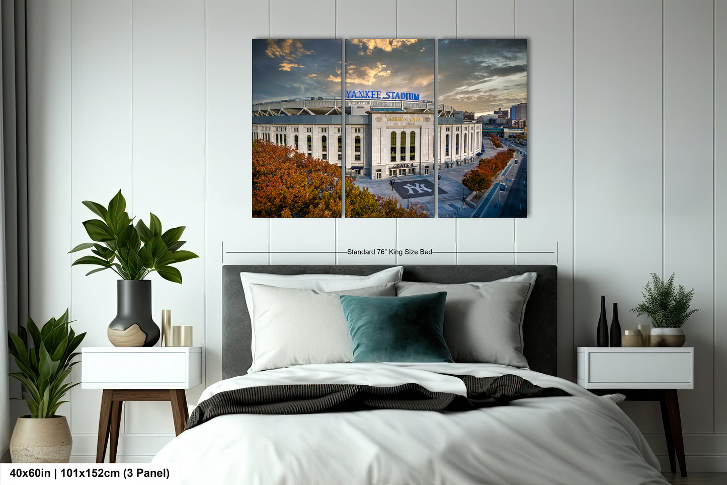 a bedroom with a large bed and a picture of a building