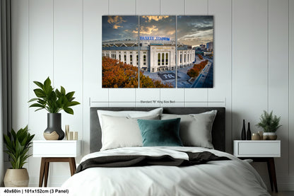 a bedroom with a large bed and a picture of a building