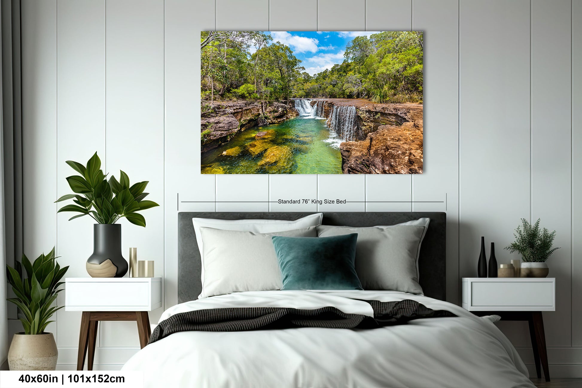 a bedroom with a bed and a painting on the wall
