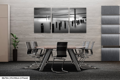 a black and white photo of a table and chairs