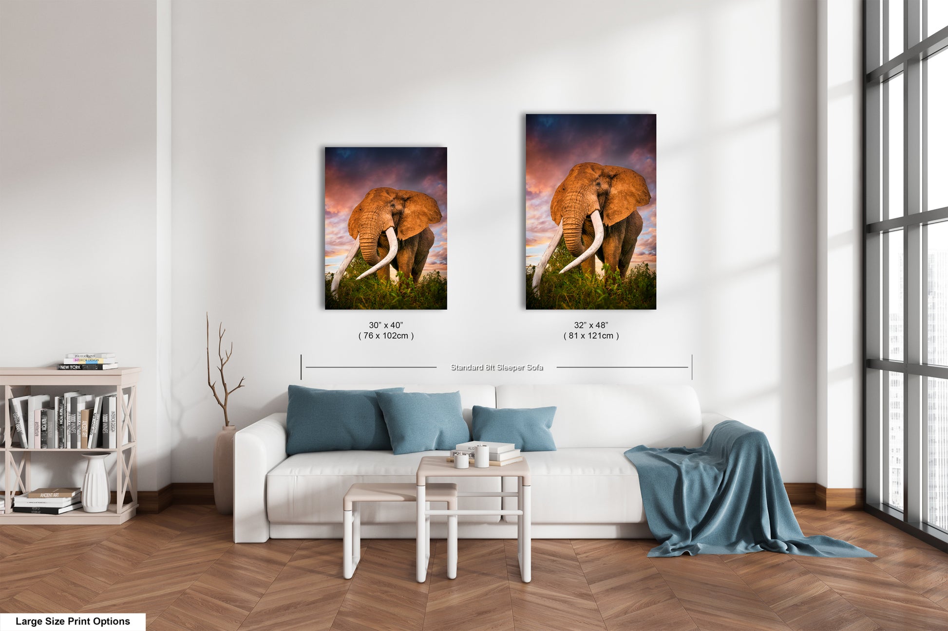 a living room with a white couch and two pictures on the wall