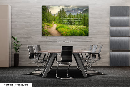 a dining room table with chairs and a picture on the wall
