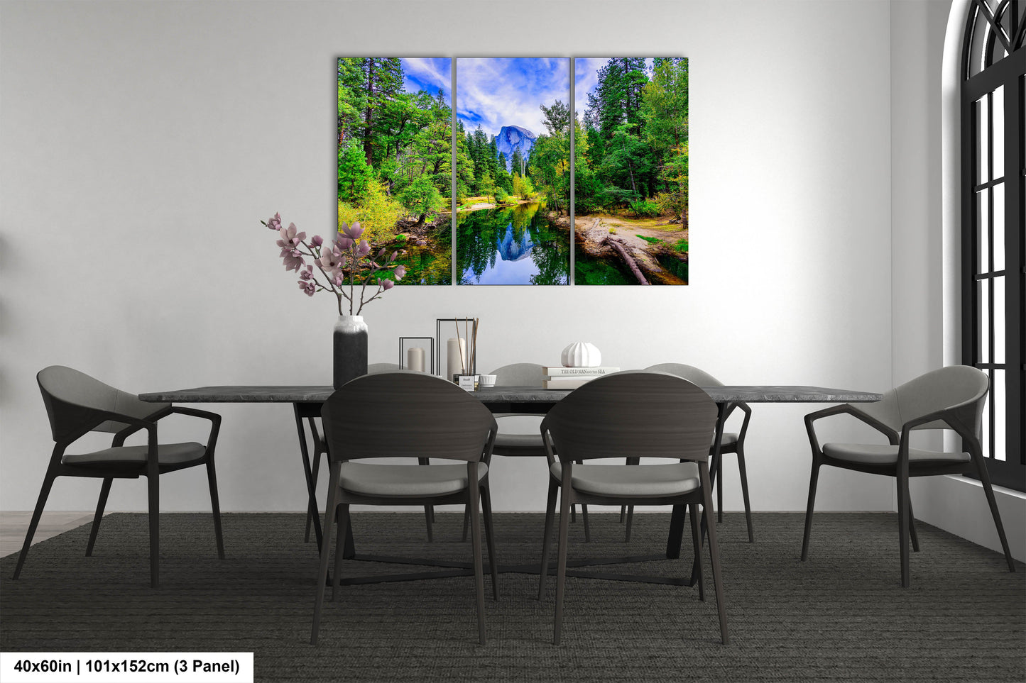 a dining room table with chairs and a painting on the wall