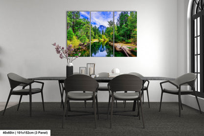 a dining room table with chairs and a painting on the wall