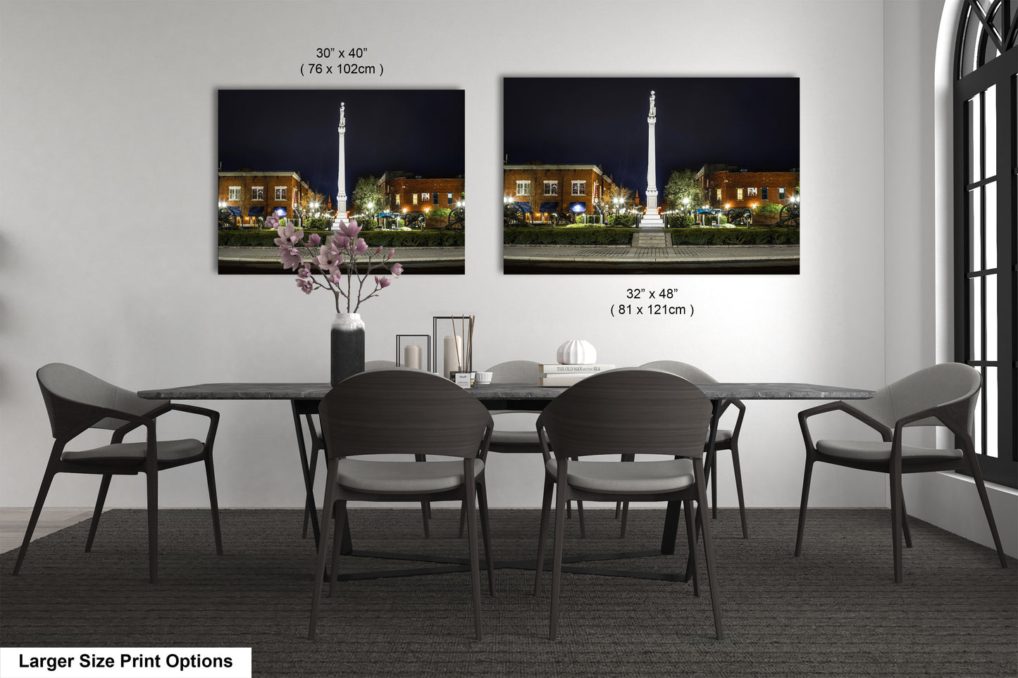 a dining room table with chairs and a vase of flowers