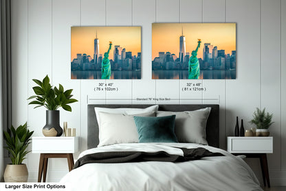 a bed with two pictures of the statue of liberty