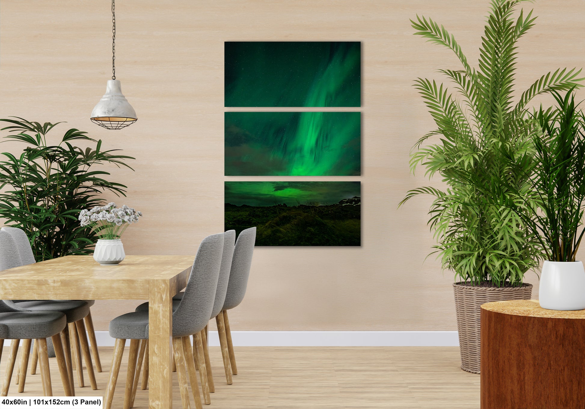 a modern dining room with a wooden table and chairs, a potted plant, and a hanging light fixture. The room has a neutral color scheme and features a large painting of the Aurora Borealis on the wall.