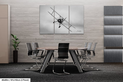 a black and white photo of a table and chairs