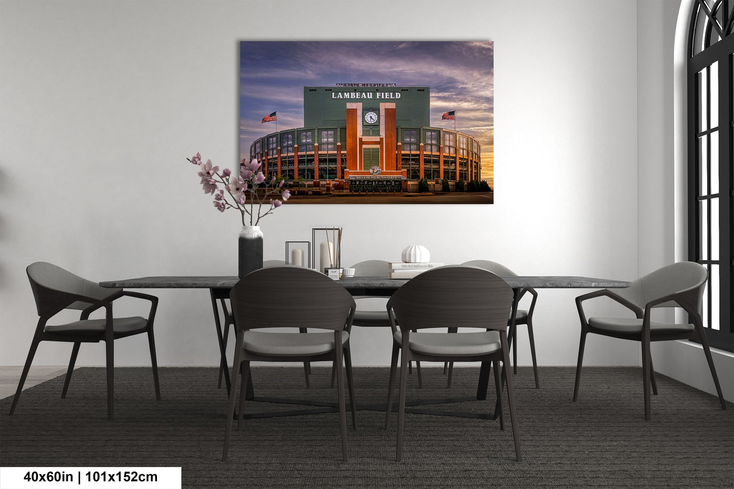 a dining room table with chairs and a picture of a baseball stadium