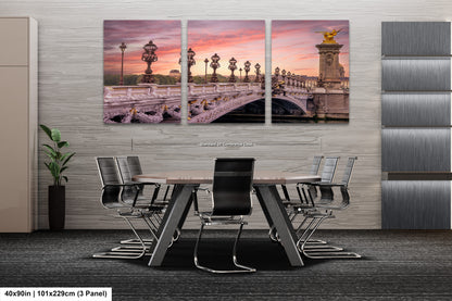 a dining room table with chairs and a painting on the wall