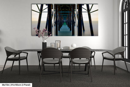 a dining room table with chairs and a painting on the wall