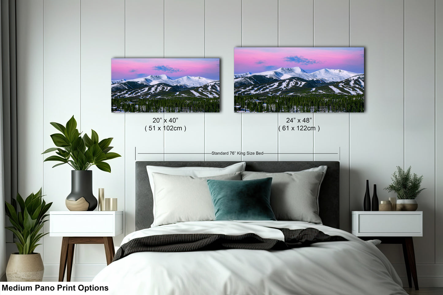a bedroom with a bed and two pictures on the wall