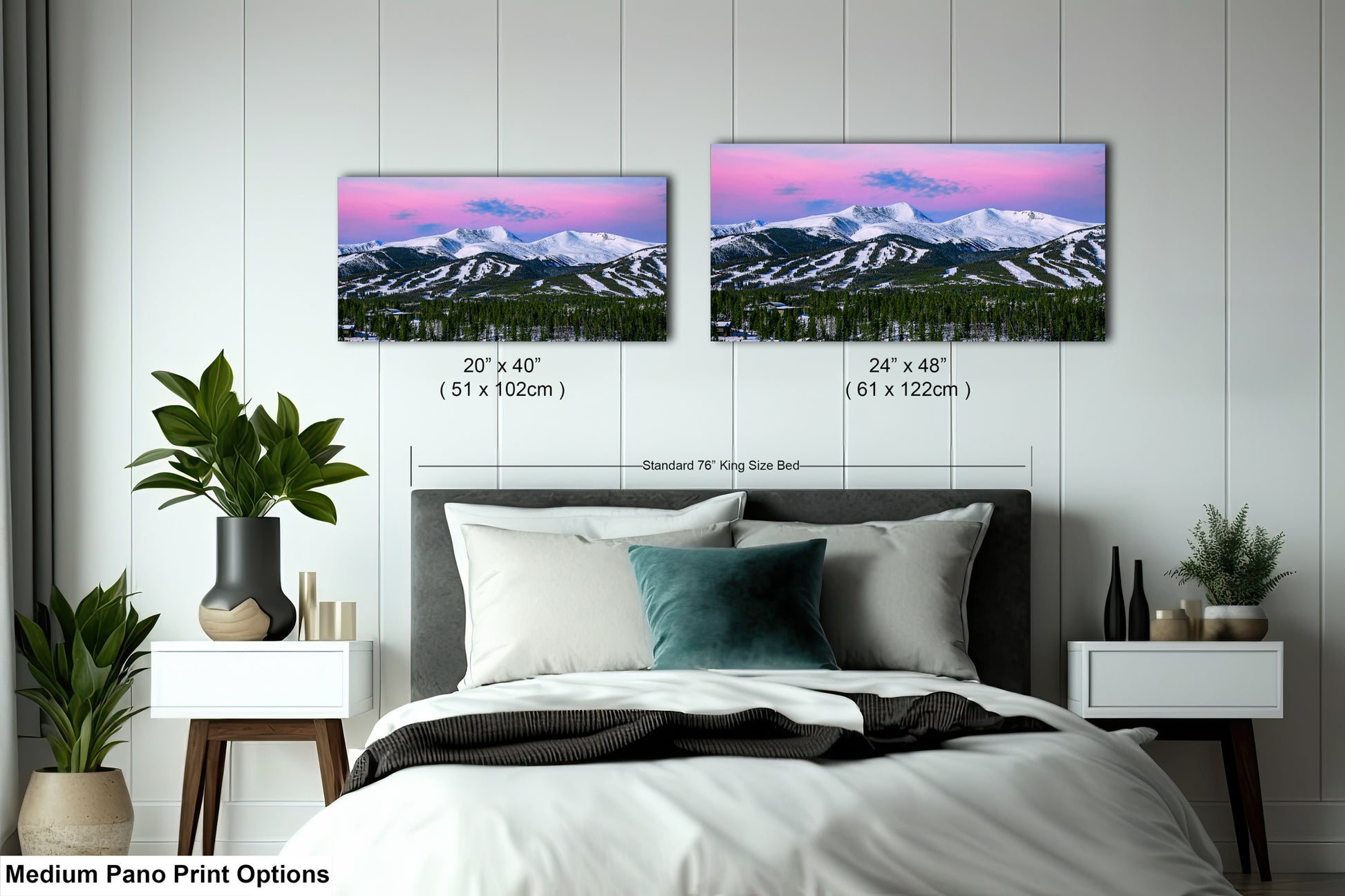 a bedroom with a bed and two pictures on the wall