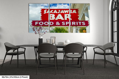 a picture of a restaurant sign hanging on a wall