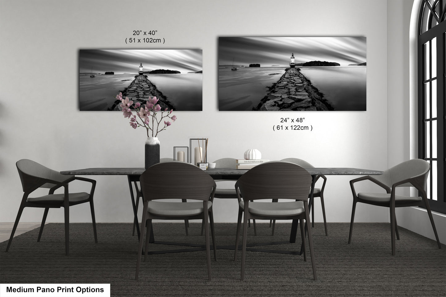 a black and white photo of a dining room table