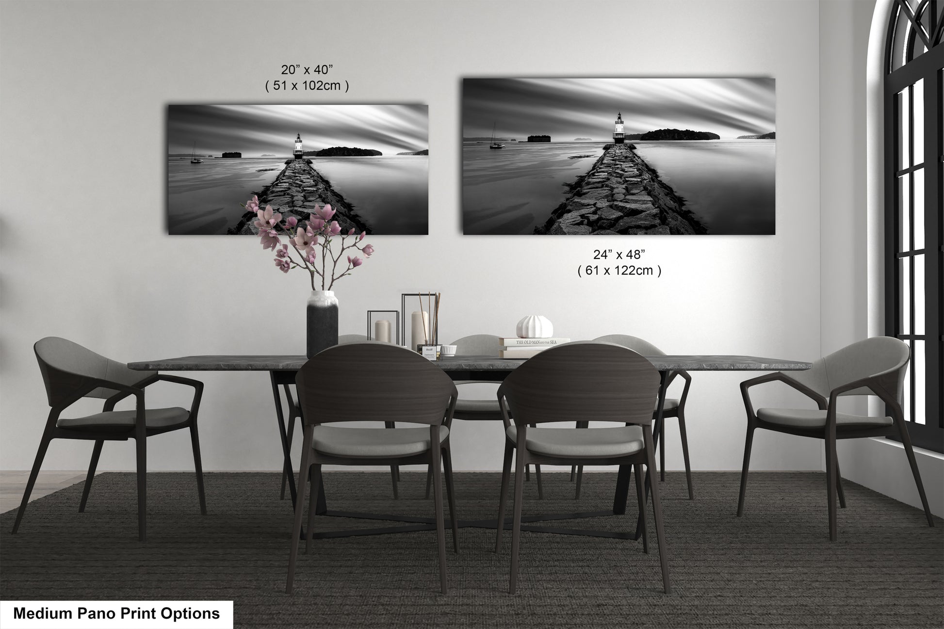 a black and white photo of a dining room table
