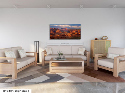 a living room filled with furniture and a painting on the wall