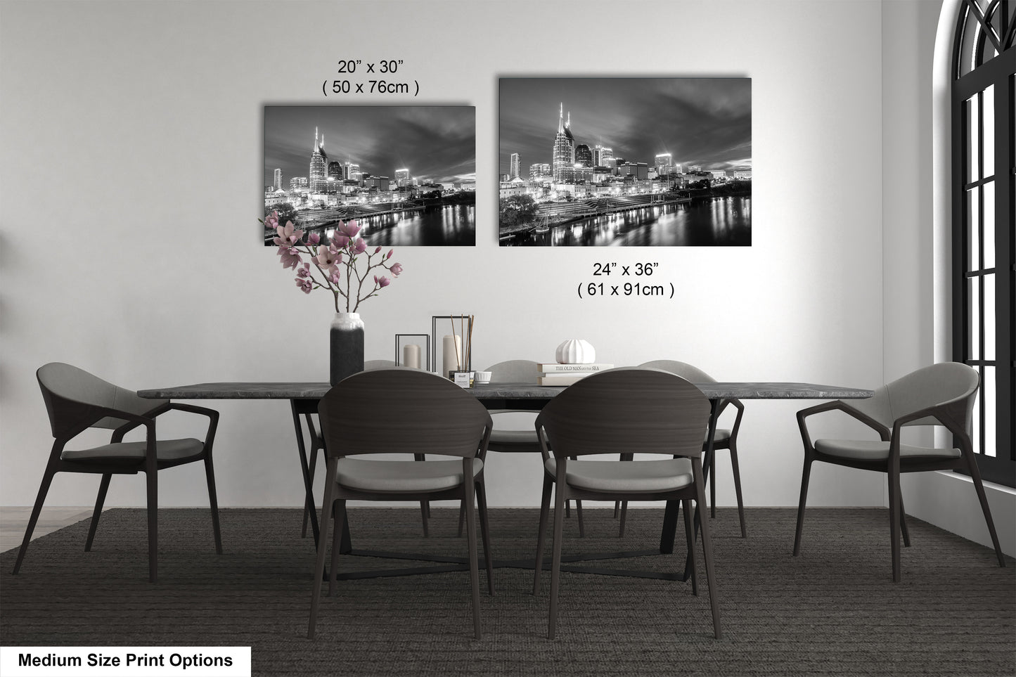 a black and white photo of a table and chairs