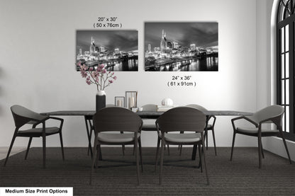 a black and white photo of a table and chairs