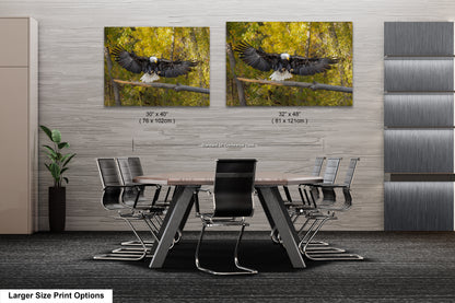 a dining room table with chairs and two pictures of an eagle