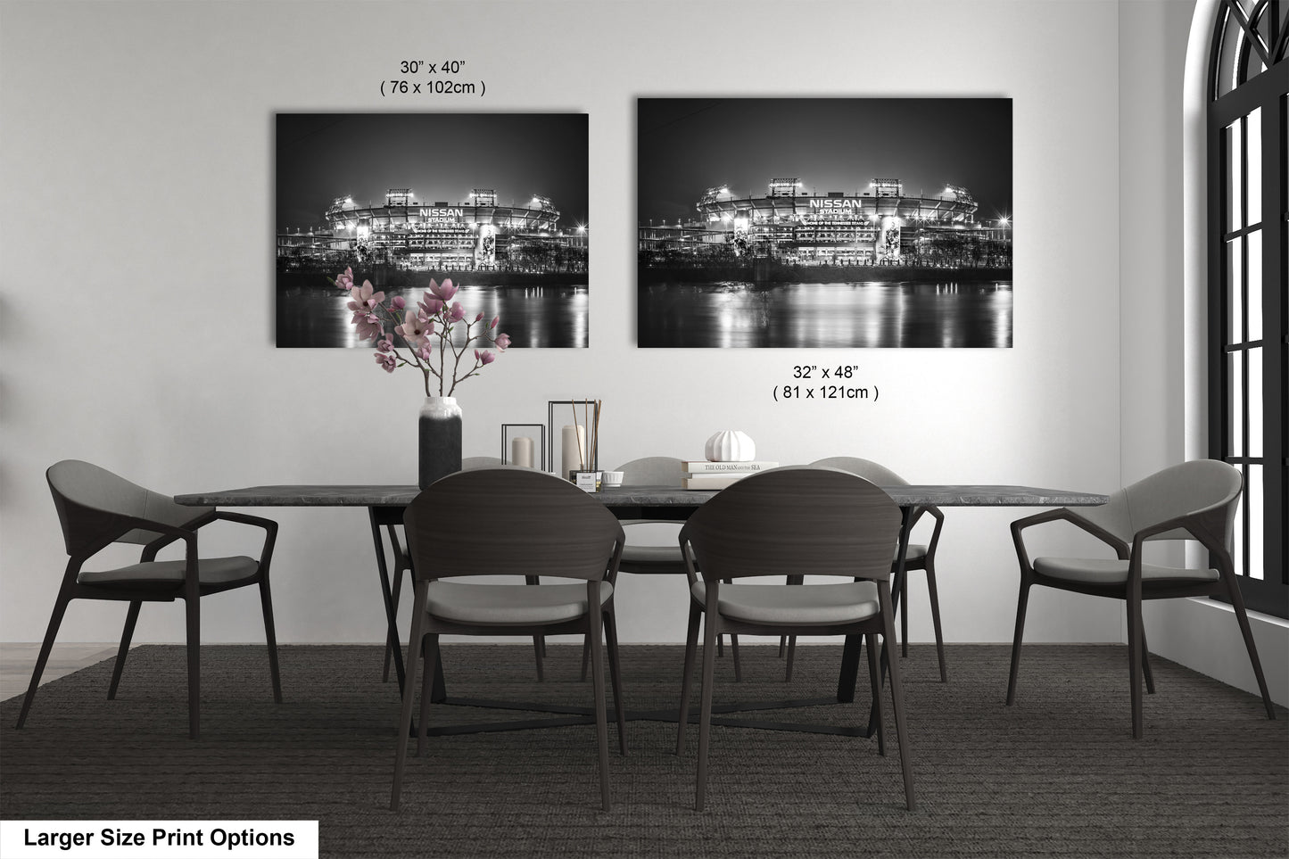 a black and white photo of a dining room table