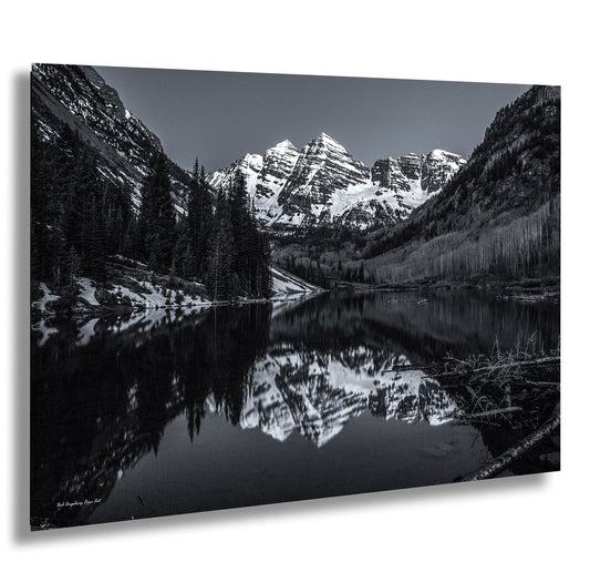a black and white photo of a mountain lake