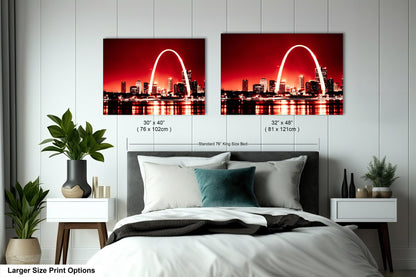 a bedroom with a bed and two pictures on the wall