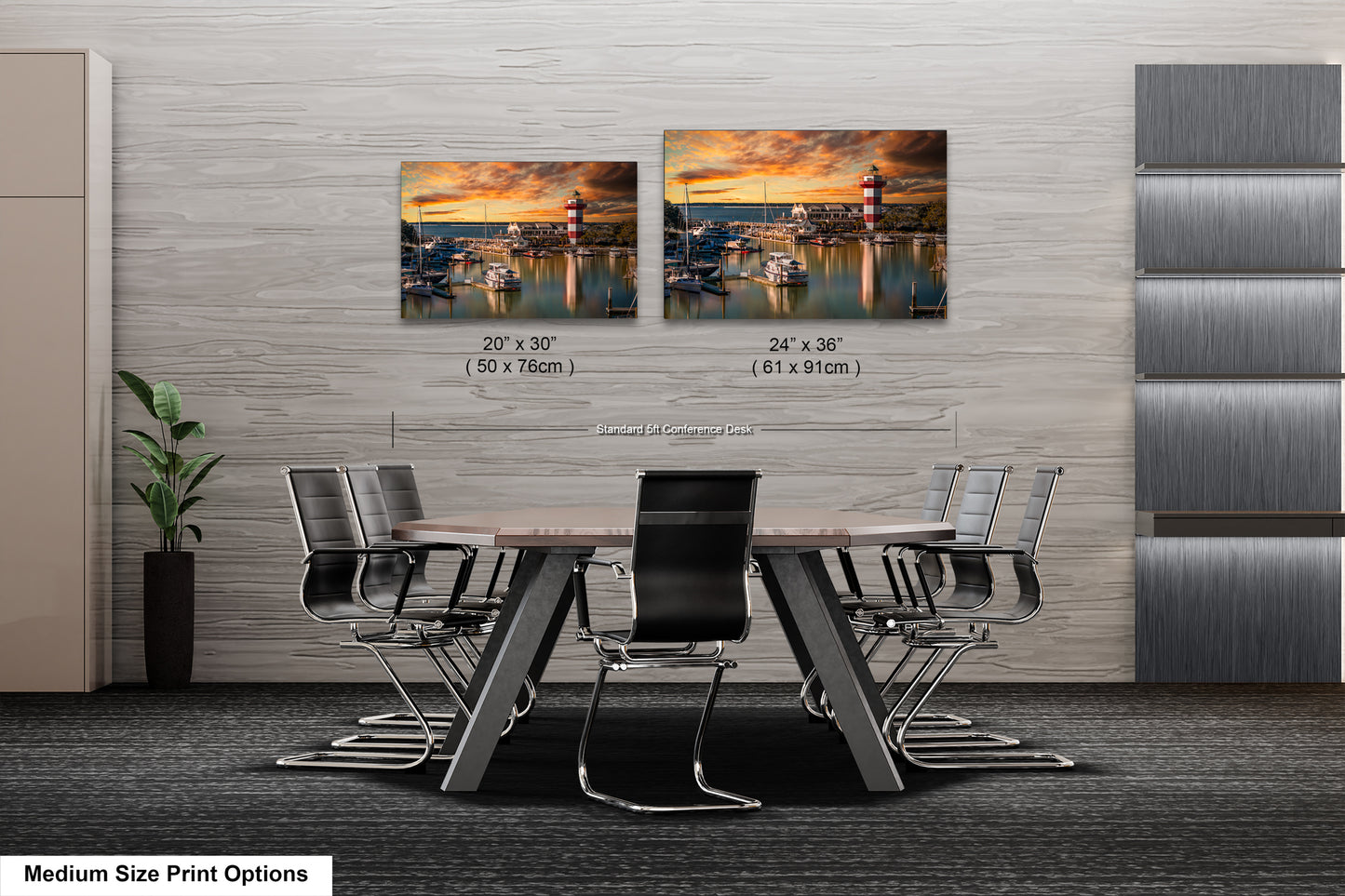 a dining room table with four chairs and two pictures on the wall