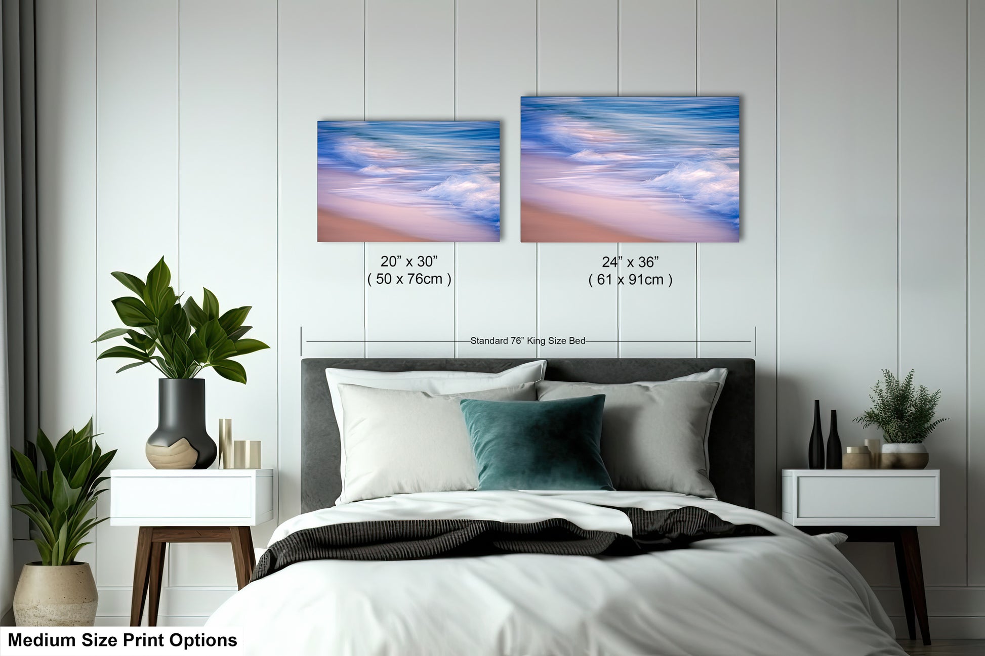 a bed with two pictures on the wall above it