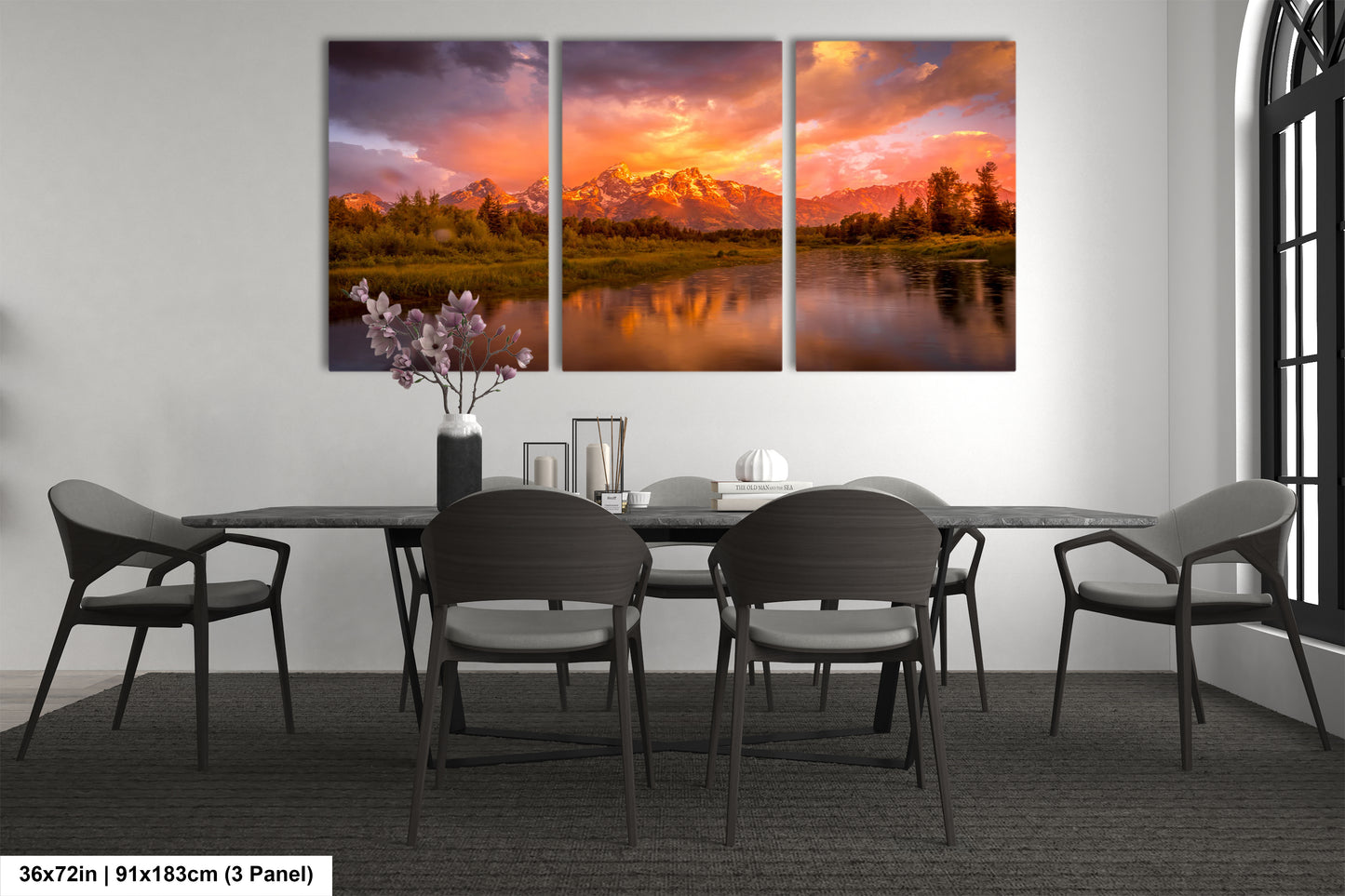 a dining room table with chairs and a painting on the wall