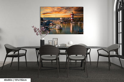 a dining room table with chairs and a painting on the wall