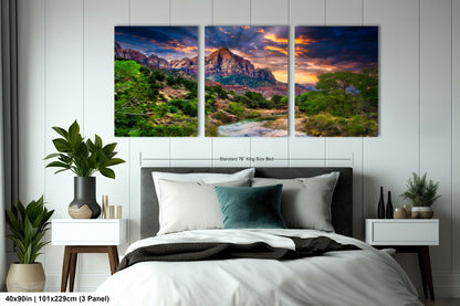 a bedroom with a bed and two paintings on the wall