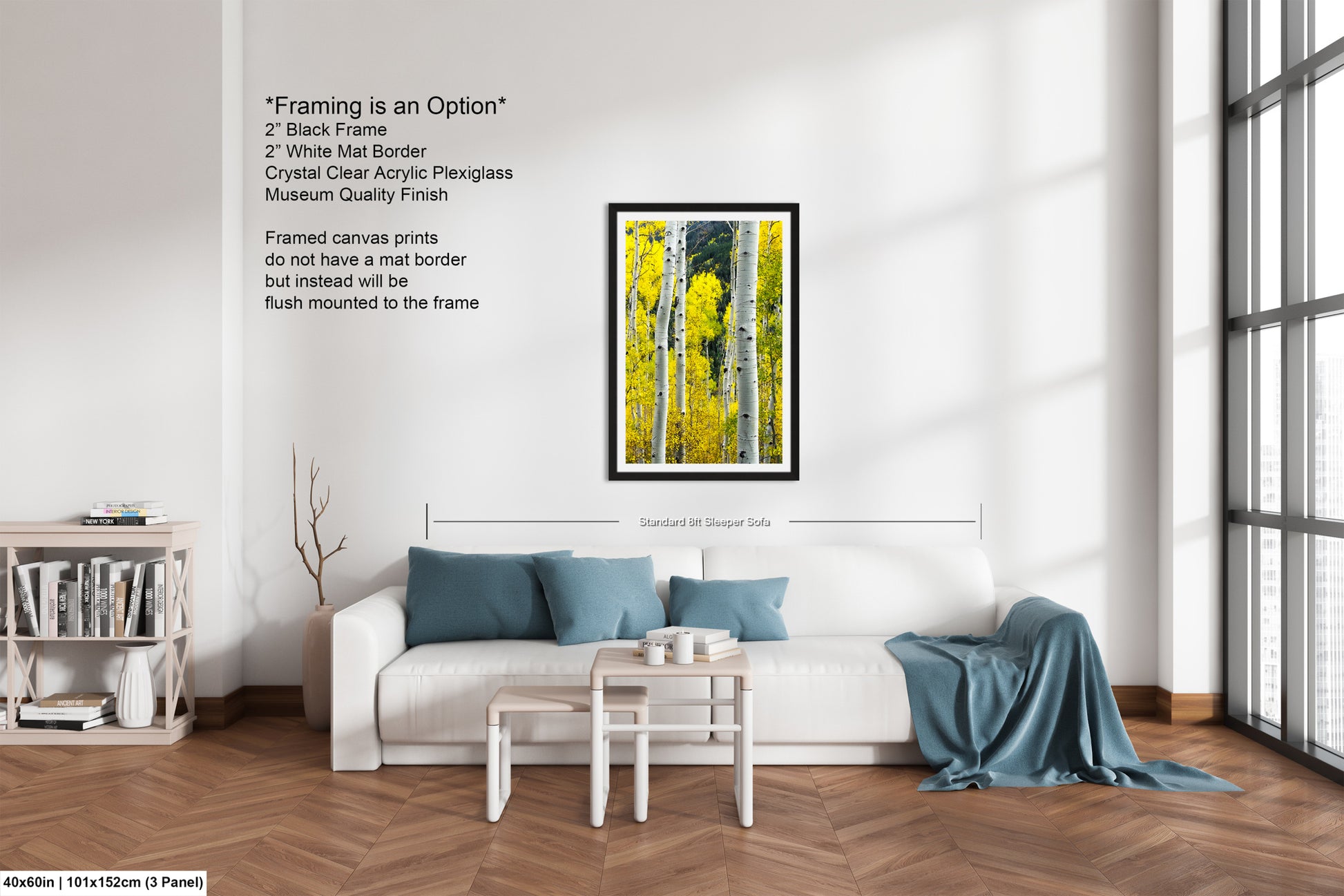 a living room with a white couch and a painting on the wall