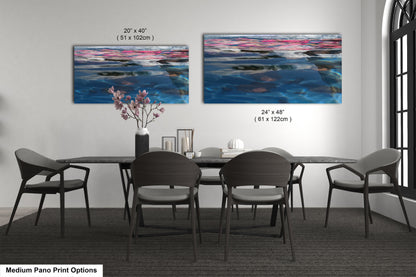 a dining room table with four chairs and a painting on the wall