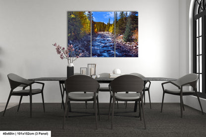 a dining room table with chairs and a painting on the wall