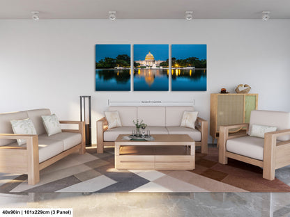 a living room filled with furniture and a painting on the wall