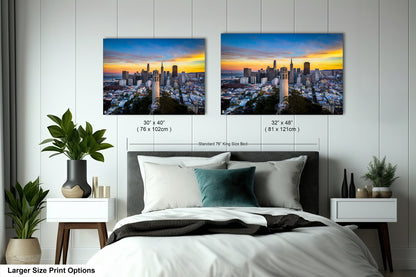 a bedroom with a bed and two pictures on the wall