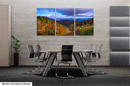 a dining room table with chairs and a painting on the wall