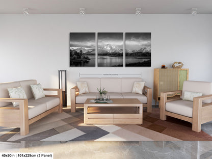 a living room filled with furniture and a painting on the wall