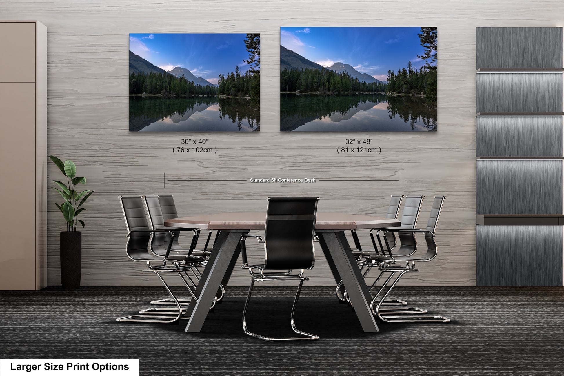 a dining room table with chairs in front of a wall with two pictures of mountains