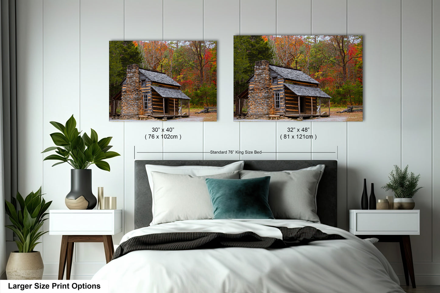 a bed with two pictures of a log cabin on the wall